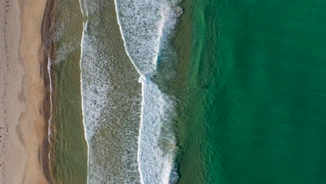 Drone-shot-of-people-surfing-at-Redhead-beach