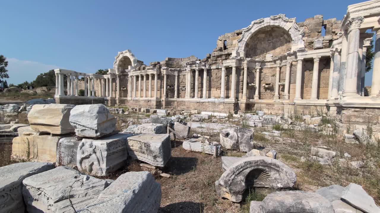 Panning across the Roman ruin of the Monumental Fountain, Nymphaeum, in the ancient city of Side, Turkey