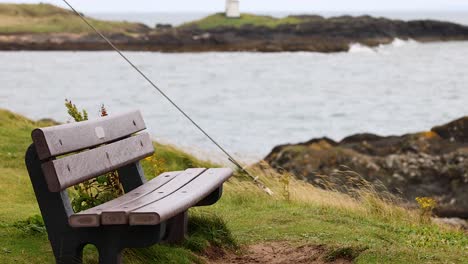 empty bench facing the sea in fife