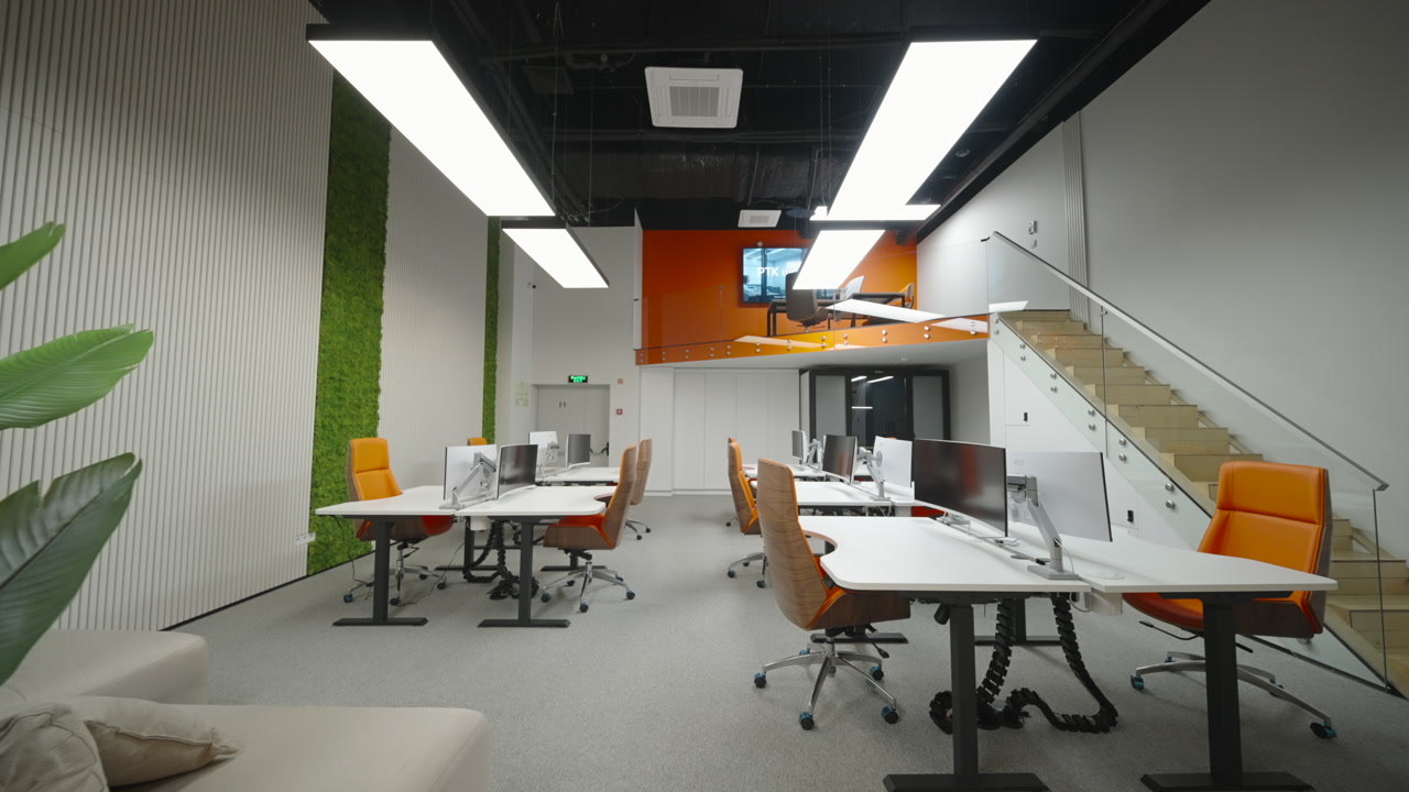 Mezzanine Creative Workspace With Stairwell View, Orange Seating And Moss Wall Glass Balustrade, Modular Desks. Creative