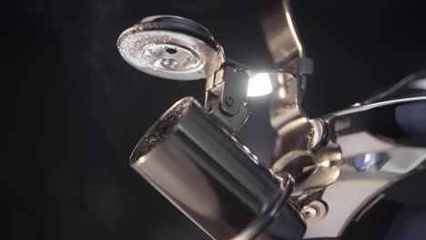 close-up of a stainless steel electric kettle with steam