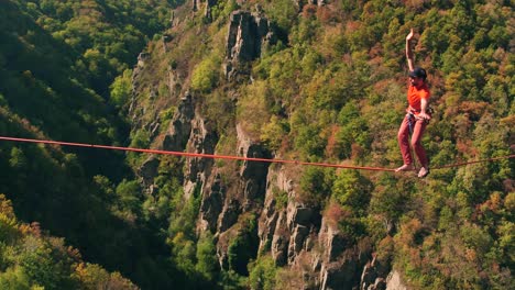 slacklining high above the mountains