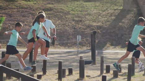 group of caucasian children training at boot camp