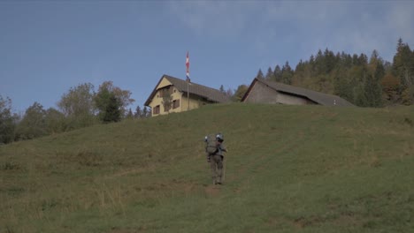 man backpacker into the field