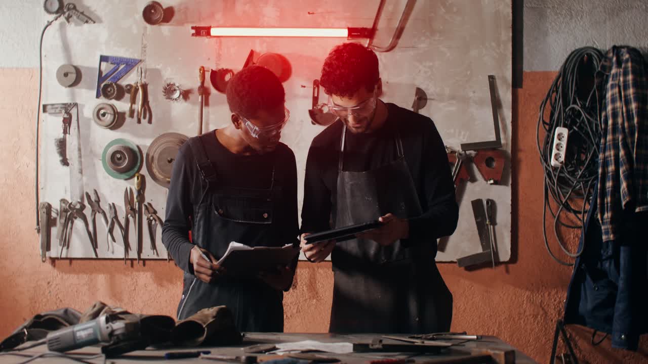 Two Workers Collaborating in a Workshop