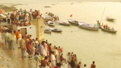 time lapse indian pilgrims rowing boat in sunrise. ganges river at varanasi india.