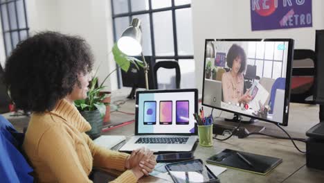 African-american-businesswoman-on-video-call-with-african-american-female-colleague-on-screen