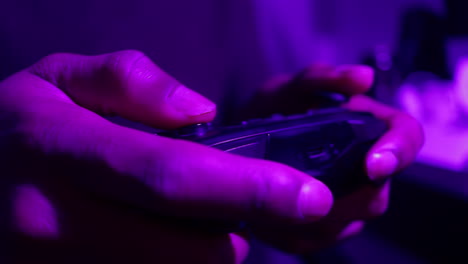 angry gamer plays video game at night