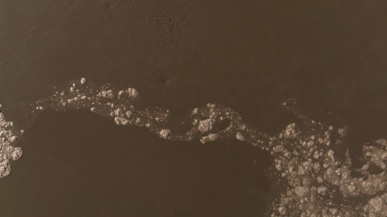 Drone captures suspended solids in wastewater treatment tank, symbolizing purification and environmental efforts