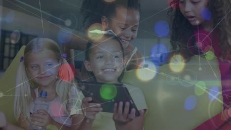 Animation-of-network-of-connections-over-happy-diverse-girls-using-tablet-at-school