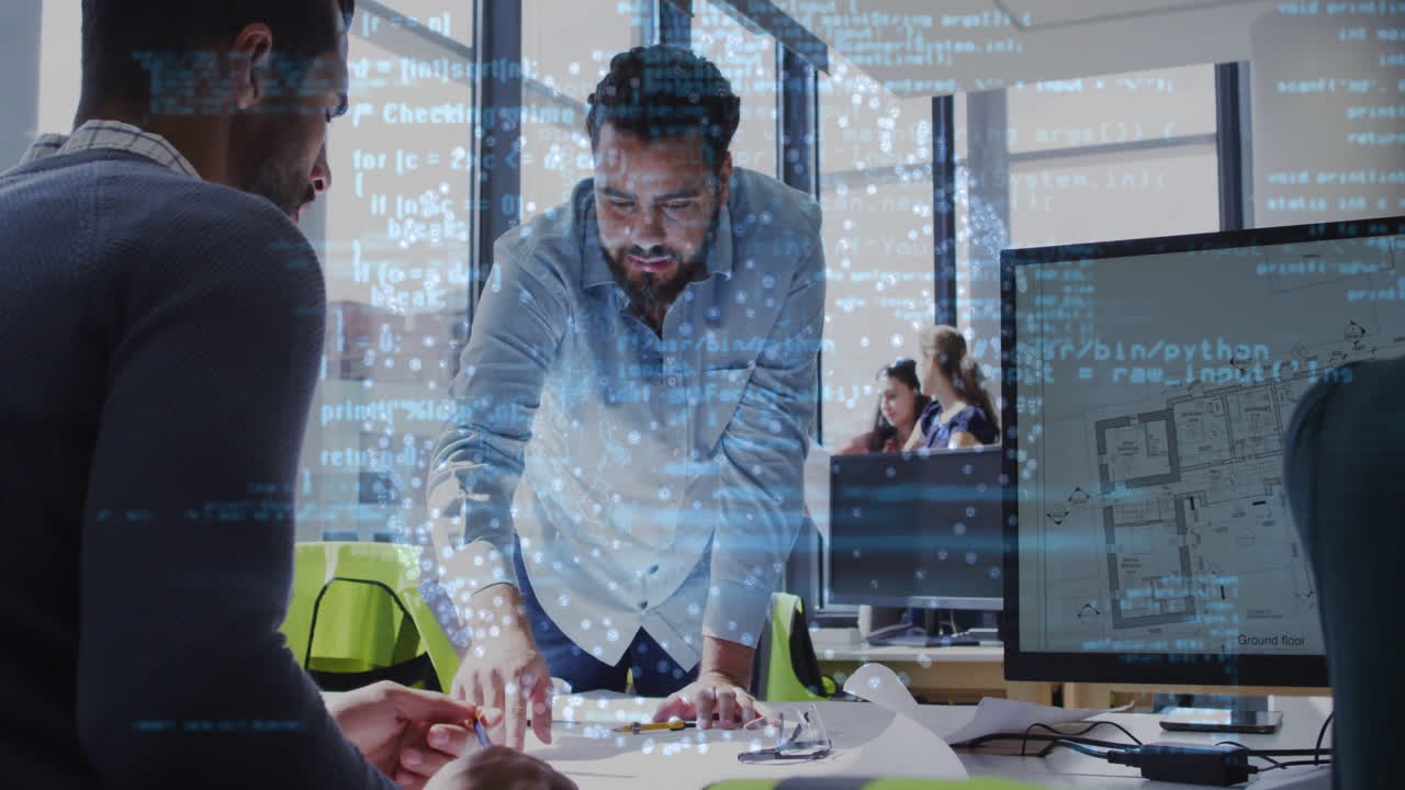 Collaborating over architectural plans, business team using digital data animation