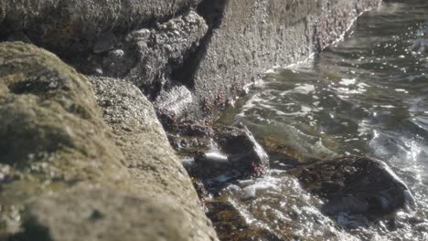 Ocean-water,-stone-environment,-tranquility,-rural-Scotland,-slow-mo