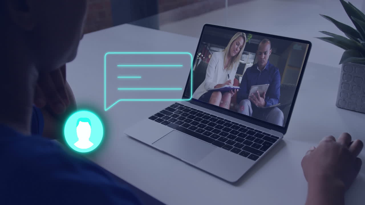 Person watching video call on laptop with chat icon animation overlay
