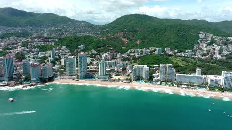 aerial tracking shot of beautiful mexico city beach coast near blue ocean at day