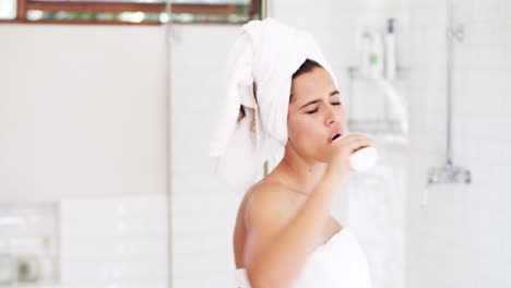 woman getting ready in the bathroom