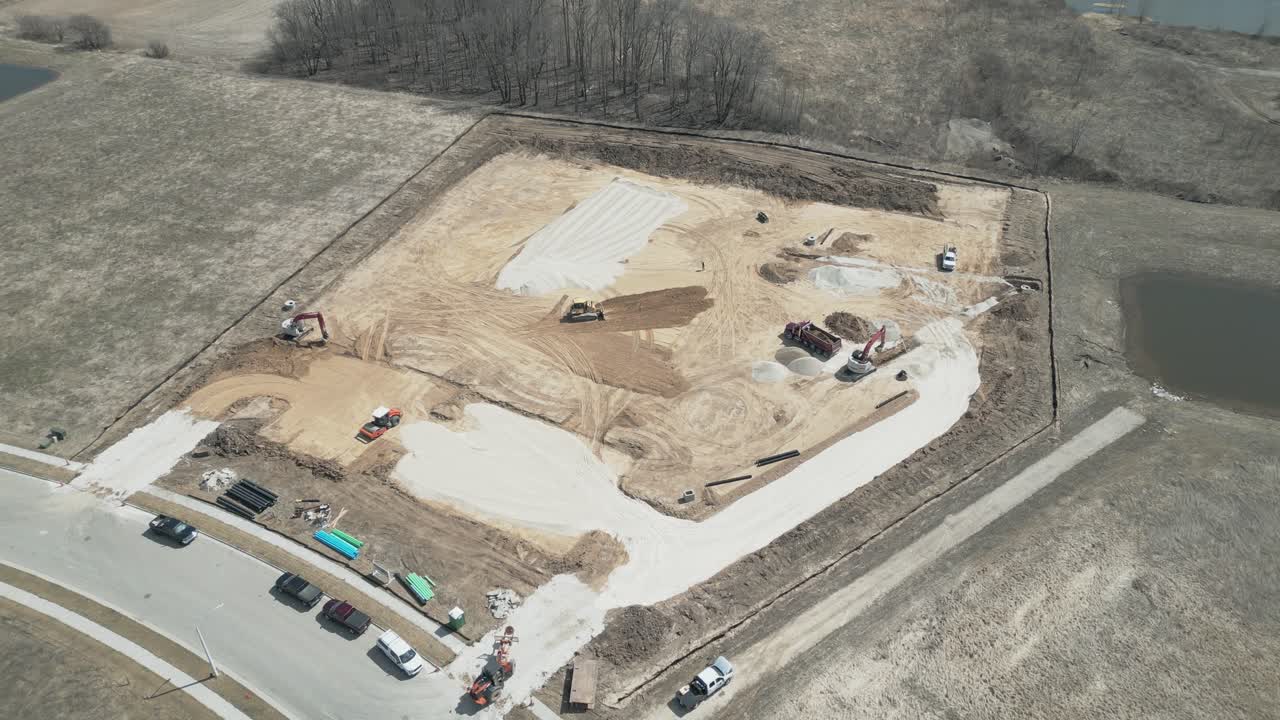 New construction projects underway in Ozaukee, Milwaukee. Aerial reverse pan out over a new and developing area