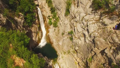 Waterfall-and-river,-green-nature-and-rocks