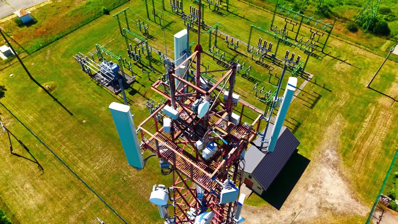 Drone descends while turning left above Garkalne electrical substation in Latvia