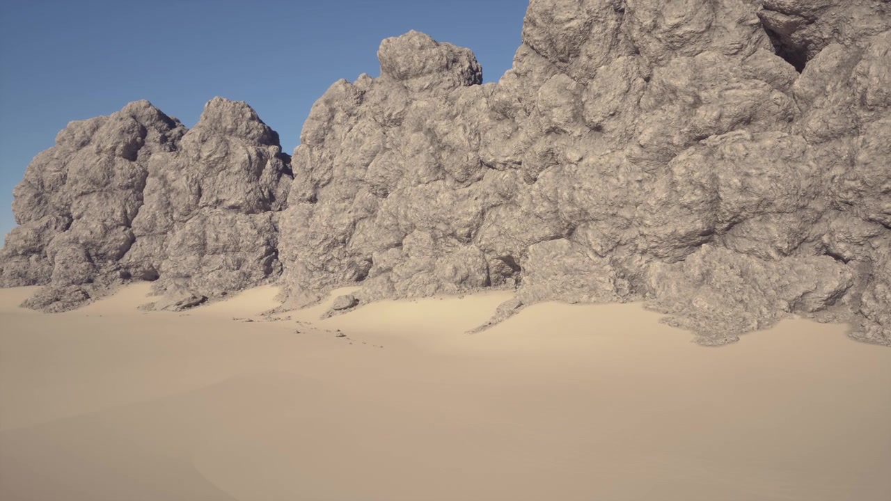 Desierto abierto y soleado con picos escarpados y patrones de arena suaves