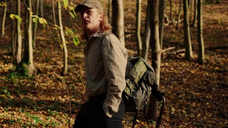 cowboy shot of man exploring virgin nature finding his way, vogelberg