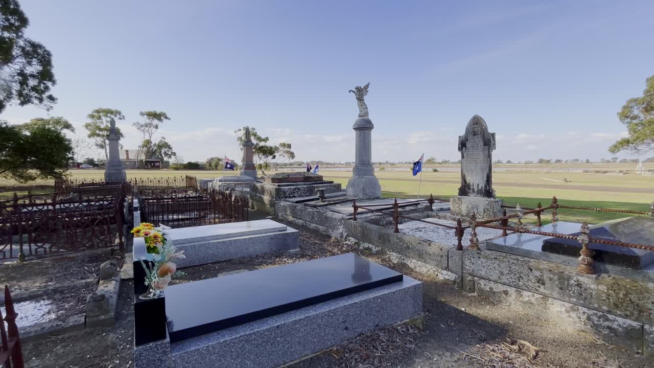 Australian Flags Waving In Wind At The Graves Of Anzac War Heroes In A Cemetery In Australia.