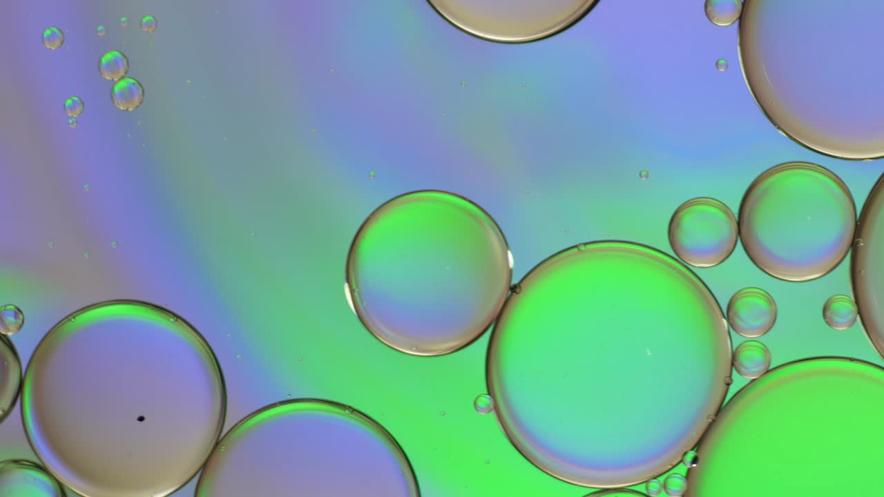 Colorful artistic of oil drop floating on the water.