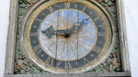 the wooden clock on the wall in the city