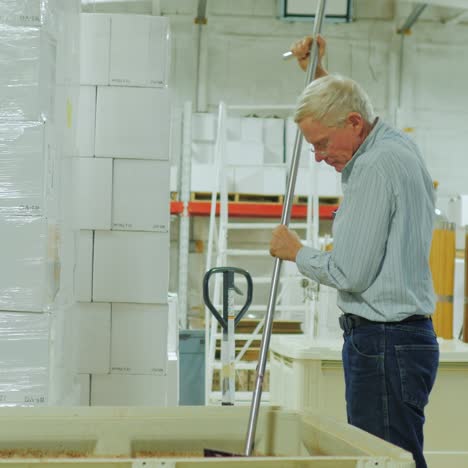 winemaker working in the winery 3