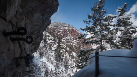 timelapse, ouray, colorado, switzerland of america, snow capped hills and trees by hiking trail on sunny winter day