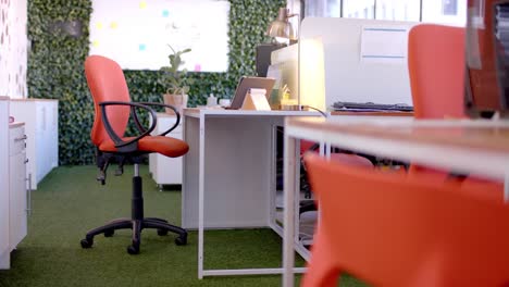 Office-interior-with-green-wall-and-whiteboard,-slow-motion