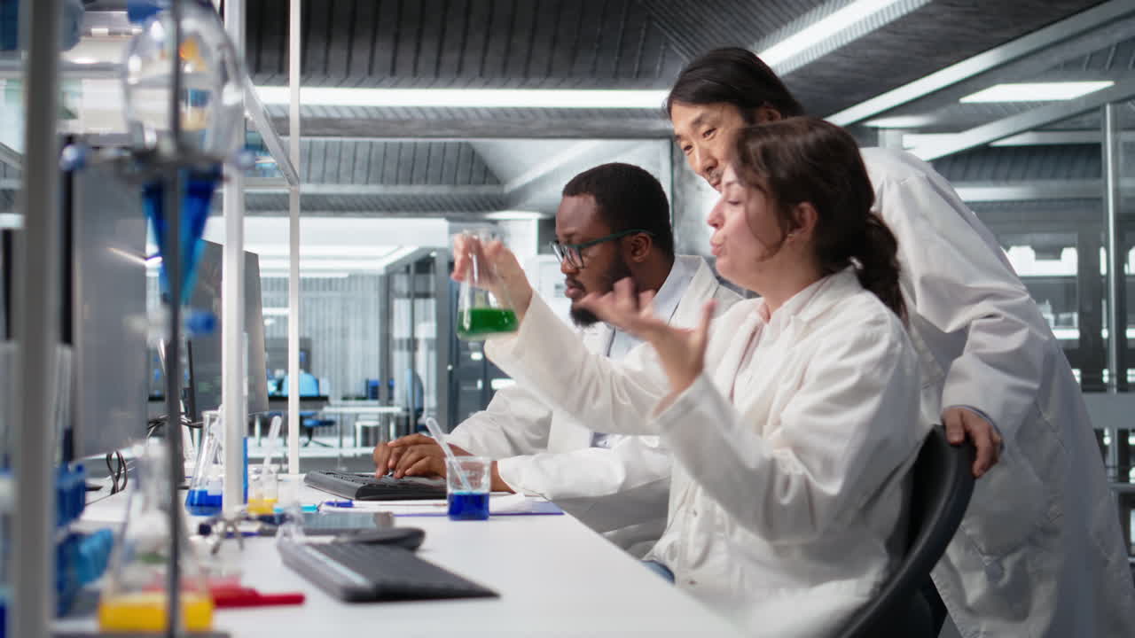 Vertical video Multiracial researchers in lab inspecting liquids in test tube