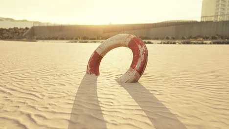 lifebuoy on the city beach at sunset