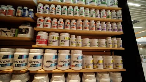 sport nutrition store interior with large choice of nutritional supplements.