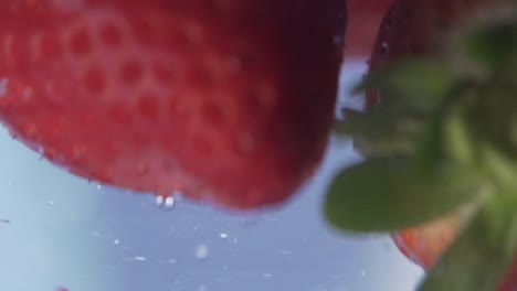 strawberries falling into water slow motion healthy organic natural fruit food diet