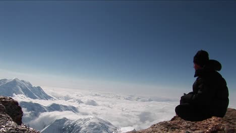 Reflection-on-ledge-high-above-clouds