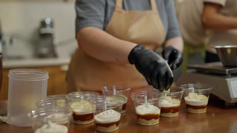 a person making banana pudding dessert