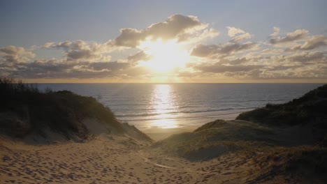 the sun setting over seconds beach at cape patterson victoria