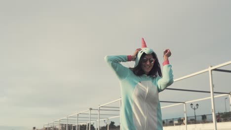 woman in unicorn pajamas at the beach