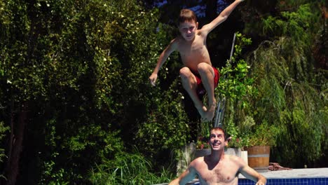 happy family having fun in swimming pool