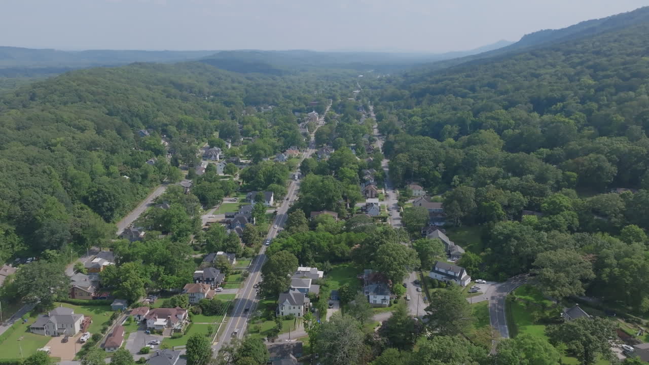 Aerial perspective of the winding streets and dense housing of St. Elmo nestled in Chattanooga’s green hills