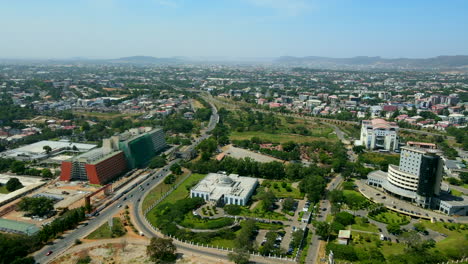 an ariel view of abuja city with a green view