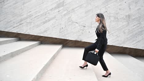 business woman wearing heels climbing the stairs in the city. high quality 4k footage .