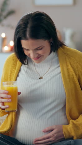 pregnant woman drinking orange juice