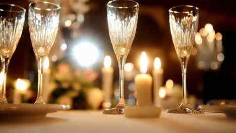 elegant dining table setting with candles and champagne glasses