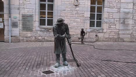 Birthplace-of-the-Lumiere-brothers,-the-first-to-commercialise-cinema,-statues-of-the-first-cinema-gag,-have-stood-in-the-courtyard-of-the-Pierre-Bayle-media-library-in-Besancon,-France