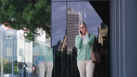 businesswoman talking on her phone in the city