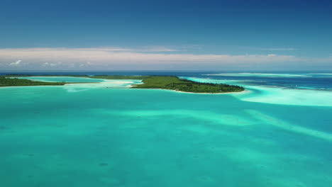 wide, beautiful aerial view over turquoise water surrounding isle of pines