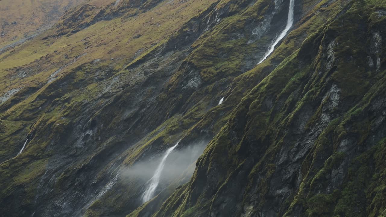 Waterfall in Rugged Mountain Scenery, Dramatic Rocky Mountains and Big Waterfalls Falling Down Mountain in Himalayas in Nepal