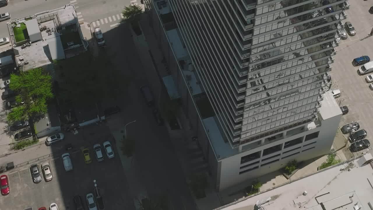 Chicago high-rise with pool and parking lot seen from above