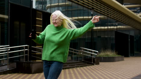 happy woman holding coffee cup outdoors